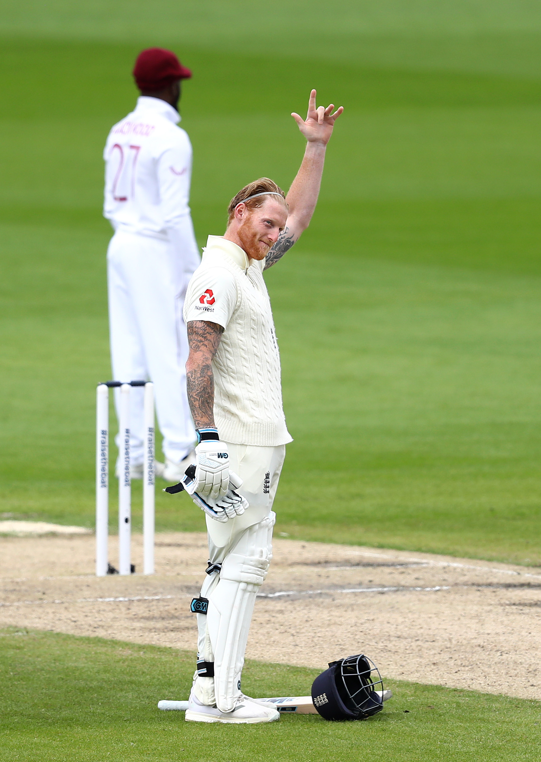 Ben Stokes of England celebrates after reaching his century by making a gesture dedicated to his father in the Test between England and The West Indies (Photo by Michael Steele/Getty Images).
